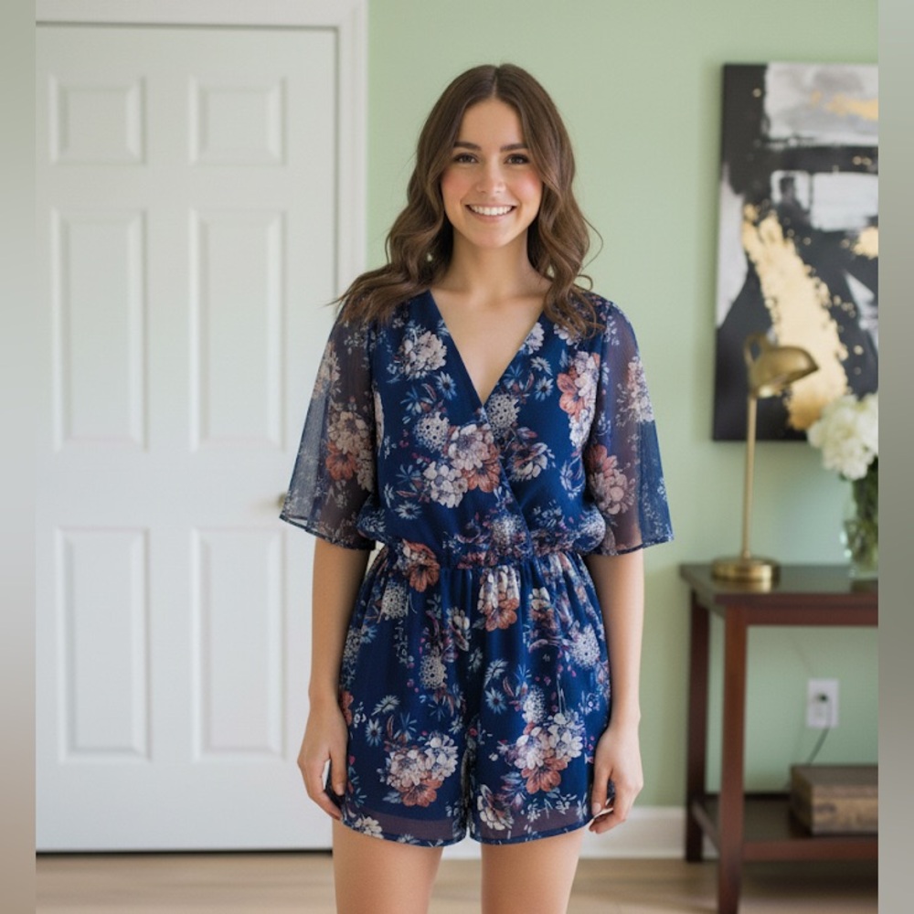 As U Wish Blue Floral Romper Size Small flowy sleeves V neck waist tie